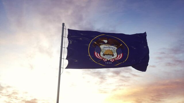 State flag of Utah waving in the wind. Dramatic sky background. 4K