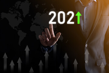 Business development to success and growing growth year 2021 concept.Plan business growth graph in year 2021 concept.Businessman plan and increase of positive indicators in his business