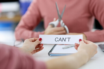 Female hands holding paper with written words can not