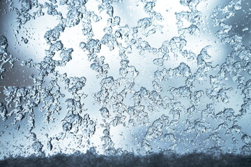 Frozen and melting ice and snow on a window