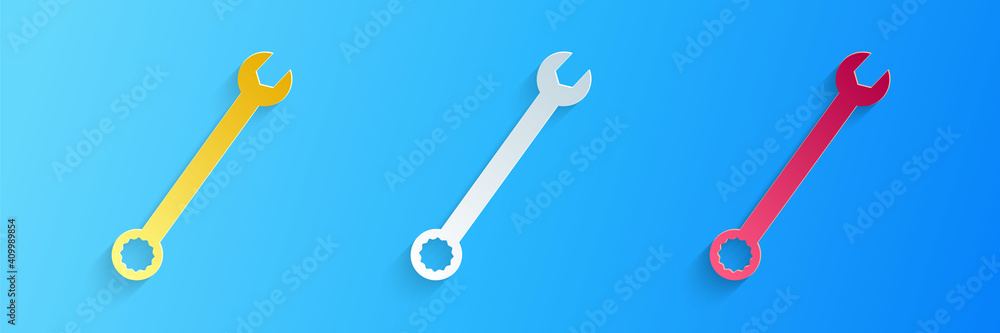 Wall mural paper cut spanner icon isolated on blue background. paper art style. vector.