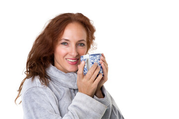 Smiling woman holding porcelain mug