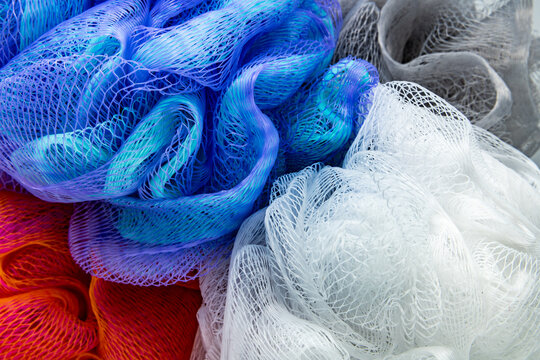Four, bunch of beauty, hygiene loofah shower sponge to clean, cleanse body with bath puff orange, purple, blue, white and gray. 