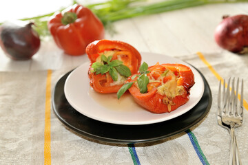 Baked halves of bell peppers stuffed with mushrooms, vegetables and cheese.