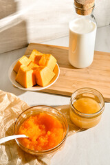 ingredients for Pumpkin pancakes on light background.