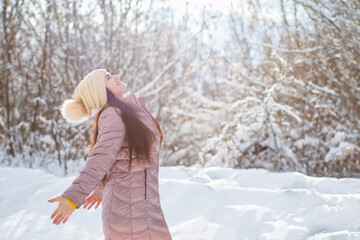 Happy woman on background of winter forest.