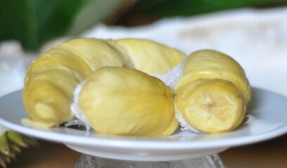Durian fruit flesh on a white plate