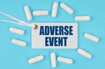 There is a label on the table among the pills that says -ADVERSE EVENT