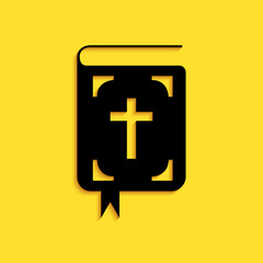 Black Bible book icon isolated on yellow background. Holy Bible book sign. Long shadow style. Vector.