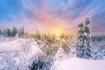 Panoramic landscape with blue color, mountains, forest, sunrise and snow cover. Ural, Russia Perm Krai Stone City.