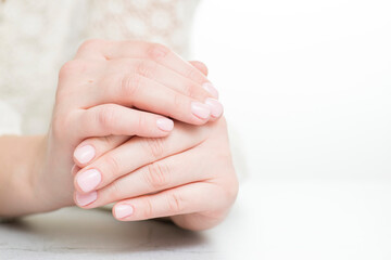 Womans hands with beautiful manicure on white background