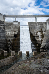 Fototapeta na wymiar The Hinze Dam is a rock and earth-fill embankment dam with an un-gated spillway across the Nerang River in the Gold Coast hinterland of South East, Queensland, Australia.