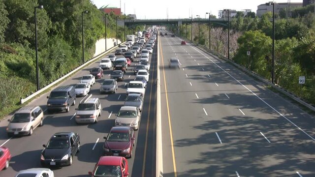 Time lapse of rush hour traffic on the Don Valley Parkway in Toronto, Ontario, Canada. Heavy vs. light traffic.