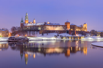 Fototapeta na wymiar Krakow winter, night Wawel Castle over Vistula river, snow, Poland
