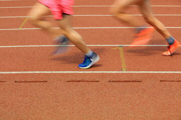 Long distance runners are running on the track