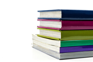 Stack of books against a plain white background. Plain cover. No people. Copy space.