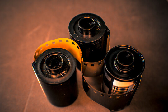 still life photo of the film rolls in sepia