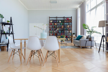 The interior design of the studio apartment in Scandinavian style. A spacious huge room in light colors. stylish expensive luxury furniture.