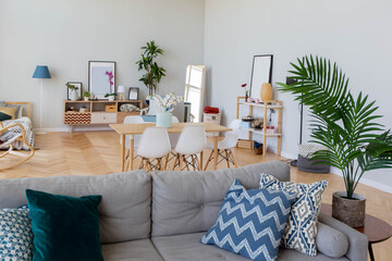 The interior design of the studio apartment in Scandinavian style. A spacious huge room in light colors. stylish expensive luxury furniture.