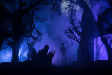 bloodthirsty zombies attacking. hungry zombies in the woods. Silhouettes of scary zombies walking...