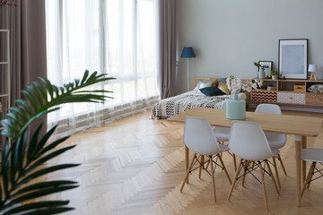 The interior design of the studio apartment in Scandinavian style. A spacious huge room in light colors. stylish expensive luxury furniture.