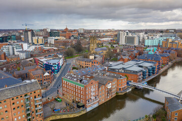 Aerial photo of the area in the Leeds City Centre known as Brewery Wharf on a beautiful sunny summers day showing buildings by the Leeds and Liverpool canal with building on the canal bank