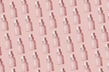 Obraz premium Dropper bottle pattern on the peach pink color background with the white cap minimal backdrop