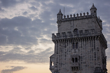 Zoom of the Belem tower with a colorful and cloudy sky in the background - Portugal images