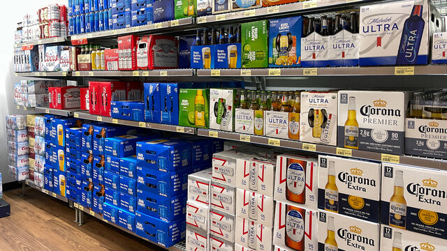 Cases of beer in a grocery store.