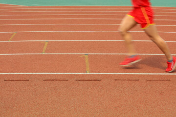 Fototapeta premium Long distance runners are running on the track