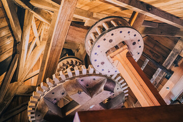 Radars and rotating parts of a traditional wooden windmill for grinding grain and flour