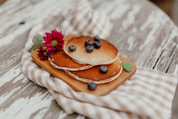 Fresh Pancakes on Plate. Close up of Delicious Dessert. Pancakes and Bluberry on top.
