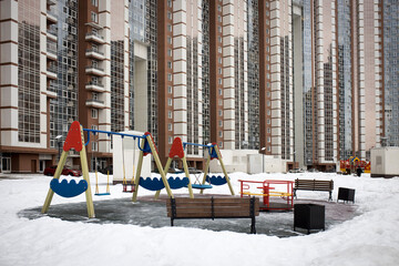 Fototapeta na wymiar A playground in the courtyard of a multi-storey residential building in Khimki, Moscow region.