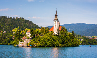 Famous Catholic Church on Island in the Middle of Bled Lake with Tourists and Boats in Bled, Slovenia