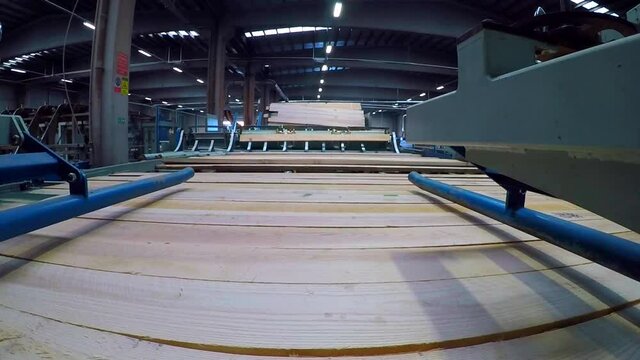 Production process in a furniture factory, woodworking machine mechanism close up. Workflow in a furniture factory. Woodworking factory