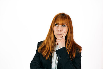 Portrait of a thoughtful redhead woman in a black suit