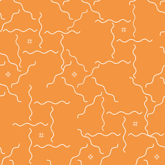 White wavy seamless patterns on an orange background. Bright and cheerful design for fabrics, scrapbooking, packaging materials, covers, textiles, t-shirts, wallpaper