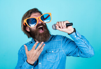love is the music. male singer singing song in microphone. celebrate the anniversary. party goer....
