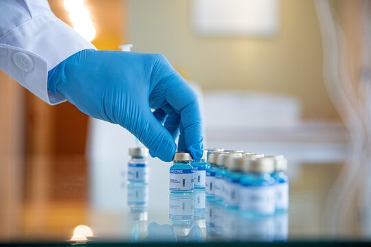 Close-up of COVID-19 coronavirus vaccine vials at the lab. Fighting with the coronavirus pandemic.