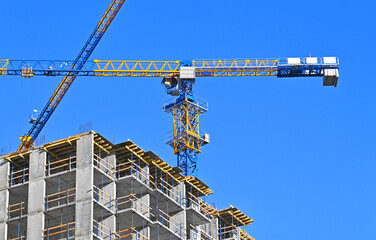 Crane and highrise construction site