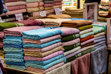 Arab store selling a variety of fabrics, Fabric in rolls