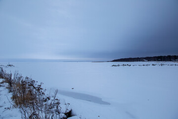 Seascape on a winter snowy day. Ladoga lake.