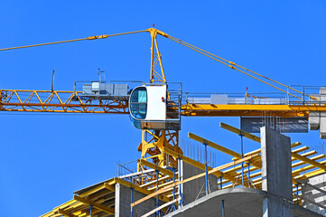 Crane and highrise construction site