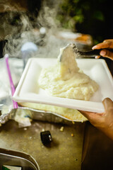 mashed potatoes with steam rolling off 