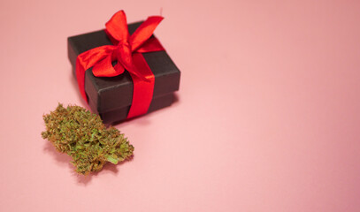 Cannabis bud in gift box. Valentines day surprise banner. Copy space 