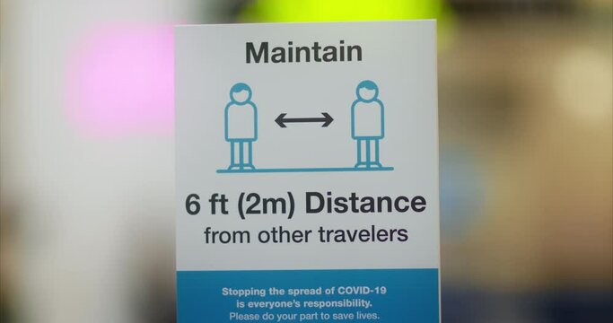 Social distance sign airport terminal reminding to keep 6 feet social distance