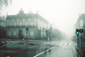 Fototapeta na wymiar View of the deserted foggy street, Porto, Portugal.
