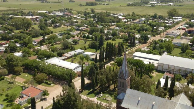 Track left of a romantic style church with Santa Anita town in background, Entre Rios, Argentina