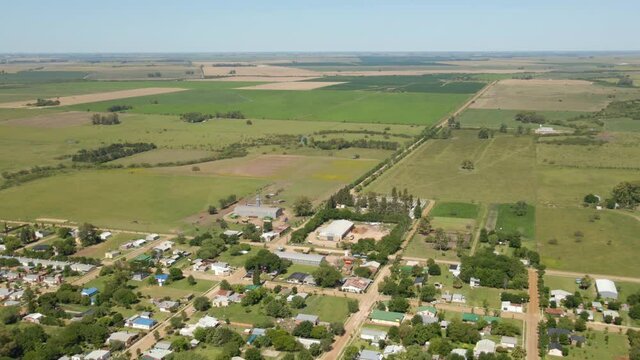 Aerial view parallax of little town of Santa Anita with Entre Rios green countryside in background, Argentina