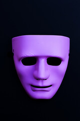 Face mask on dark background.